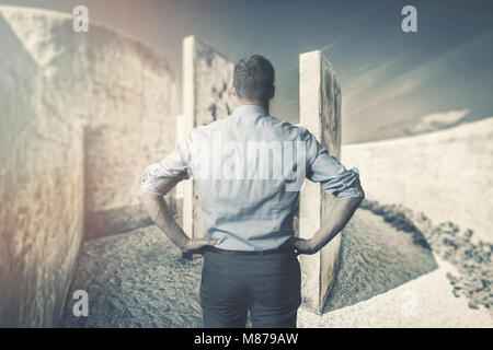 business difficulties and challenges. businessman in front of labyrinth Stock Photo