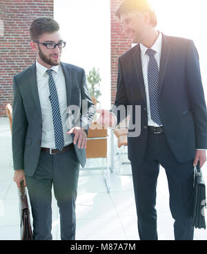Two company employees discuss business issues Stock Photo