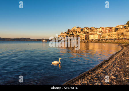 Anguillara Sabazia, Italy - The Bracciano lake at sunset from the old stone town on the waterfront. Province of Rome, central italy Stock Photo