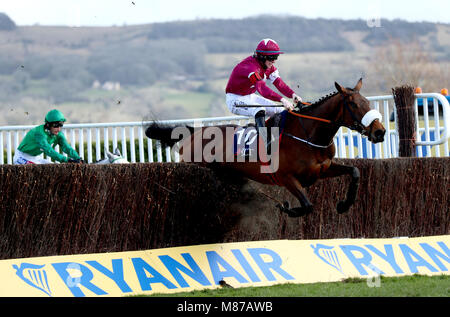 Shattered Love ridden by jockey Jack Kennedy goes on to win the JLT Novices' Chase during St Patrick's Thursday of the 2018 Cheltenham Festival at Cheltenham Racecourse. Stock Photo