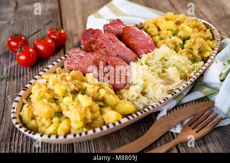 Leberkaese with sauerkraut and potato Stock Photo