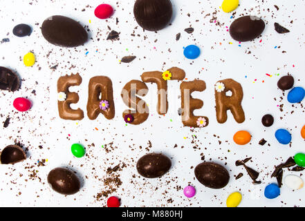 Easter card made of cookies with chocolate eggs on white Stock Photo