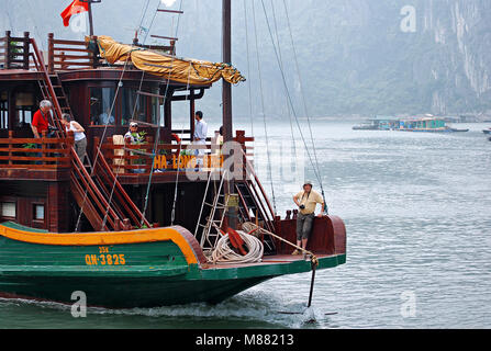 Cruising among beautiful limestone rocks in Ha Long bay, UNESCO world heritage site,  Vietnam - Chinese Junk, ancient chinese sailing ship Stock Photo