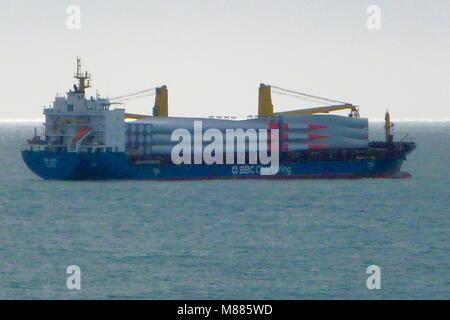 Lyme Bay, Portland. 15th March 2018 - A ship laden with giant wind-turbine blades takes shelter off Chesil Beach, Portland, from the strong south-westerlies which blew in during the morning Credit: stuart fretwell/Alamy Live News Stock Photo