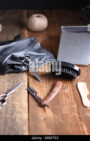 Vintage tools of barber shop on wooden background Stock Photo