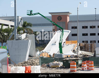 Miami, USA. 15th Mar, 2018. Photo taken on March 15, 2018 shows part of the collapsed footbridge in Miami, Florida, the United States, March 15, 2018. A pedestrian footbridge near Florida International University (FIU) collapsed Thursday afternoon, causing 'several fatalities,' local authorities said. Credit: Monica McGivern/Xinhua/Alamy Live News Stock Photo