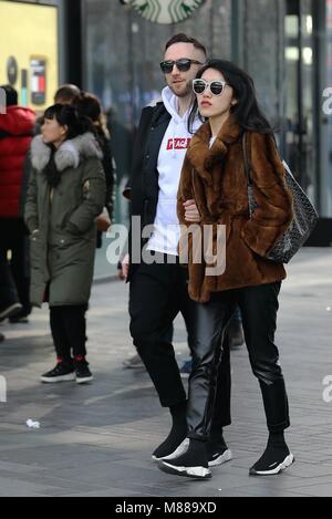 Beijing, Beijing, China. 15th Mar, 2018. Beijing, CHINA-March 15th 2018: Chic young people walk in Sanlitun, the fashion hub in Beijing. Credit: SIPA Asia/ZUMA Wire/Alamy Live News Stock Photo