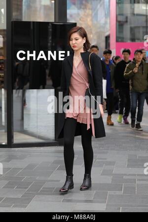 Beijing, Beijing, China. 15th Mar, 2018. Beijing, CHINA-March 15th 2018: Chic young people walk in Sanlitun, the fashion hub in Beijing. Credit: SIPA Asia/ZUMA Wire/Alamy Live News Stock Photo