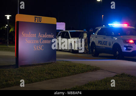 Miami, USA. 15th Mar, 2018. Police vehicles are seen in the Florida International University campus after a deadly pedestrian footbridge collapse, in Miami, Florida, United States, on March 15, 2018. A pedestrian footbridge near Florida International University (FIU) collapsed Thursday afternoon, causing 'several fatalities,' local authorities said. Credit: Monica McGivern/Xinhua/Alamy Live News Stock Photo