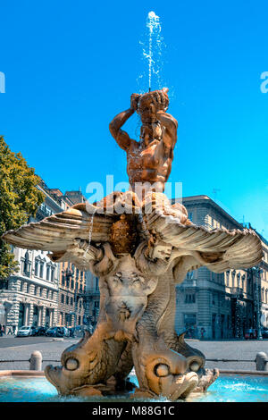 Bernini's Baroque Triton Fountain with dolphins and bees gushes water on sunny day with blue sky in Piazza Barberini in Rome Stock Photo