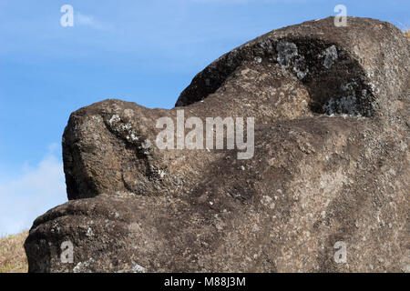 Leaning stone head  close up in Rano Raraku moai quarry on Easter Island Stock Photo
