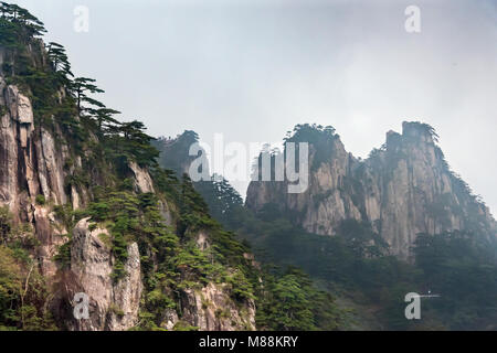 Distant walkway for viewing the rock formations of the Huangshan mountains, Anhui Province, China Stock Photo