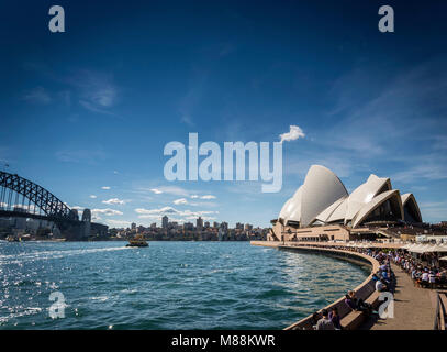 sydney opera house and harbour promenade outdoor cafes in australia on sunny day Stock Photo