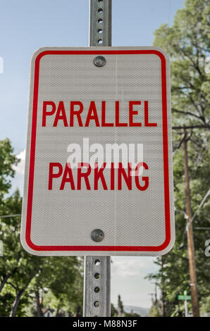 Red and white parallel parking sign found in a small town Stock Photo