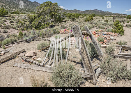 Part of an old cemetery in Utah with various methods of marking burial plots.  Someone has visited each grave recently and left something for the dead Stock Photo