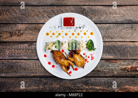 Quails meat on the grill. Stock Photo