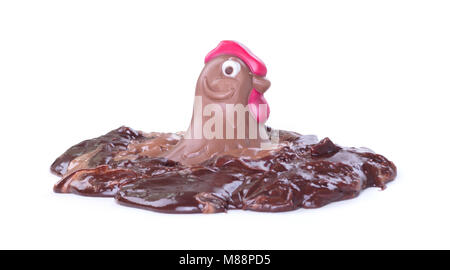 Melting chocolate easter chicken - Isolated on white background Stock Photo