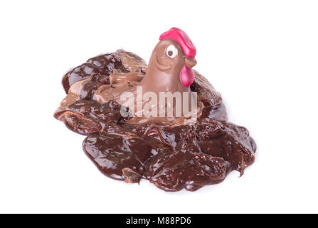 Melting chocolate easter chicken - Isolated on white background Stock Photo