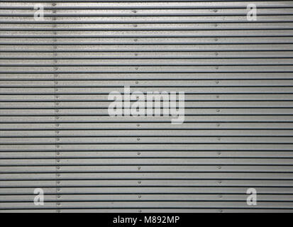 Corrugated metal wall, detail of a wall lined with metal, shiny steel Stock Photo