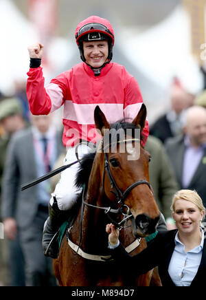 Jockey Paul Townend celebrates after winning the Trull House Stud Mares' Novices' Hurdle with horse Laurina during St Patrick's Thursday of the 2018 Cheltenham Festival at Cheltenham Racecourse. Stock Photo