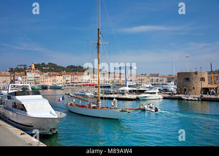 Sailing boat leaving the harbour of Saint-Tropez, french riviera, South France, Cote d'Azur, France, Europe Stock Photo