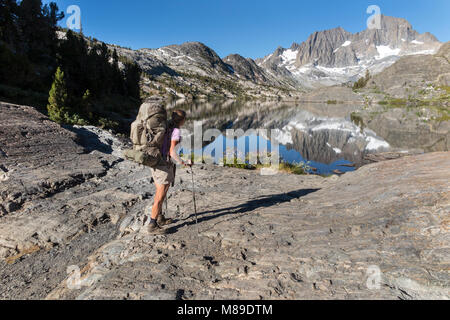 CA03353-00...CALIFORNIA - Vicky Spring hiking the John Muir Trail at Garnet Lake in the Ansel Adams Wilderness. (MR# S1) Stock Photo