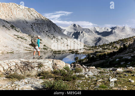 CA03394-00...CALIFORNIA - Vicky Spring hiking the John Muir Trail at Marjorie Lake in Kinga Canyon National Park. (MR# S1) Stock Photo