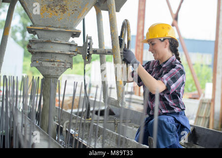 female builder on building site Stock Photo