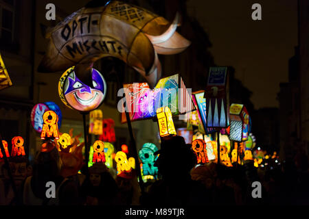 Schneidergasse, Basel, Switzerland - February 19th, 2018. A carnival group with colorful illuminated lanterns during the morgestraich parade Stock Photo