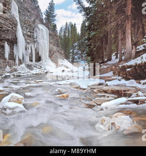 south fork of west fork gallatin river in winter along the trail to ouzel falls near big sky, montana Stock Photo