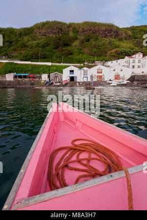 Traditional Whaling Boat approaching Nautical Club in Lajes do Pico, Pico Island, Azores, Portugal Stock Photo