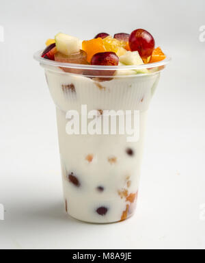 Fruit and yogurt in a plastic cup as a take away snack Stock Photo