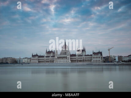 Dawn twilight shot of the Hungarian Parliament taken from the opposite bank of the River Danube in Budapest Stock Photo
