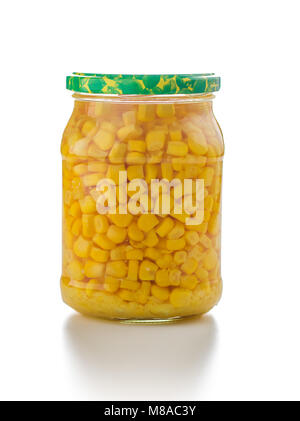 Corn seed in glass jar isolated on white background. Stock Photo