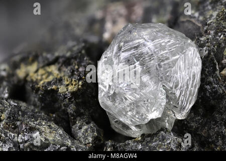 natural diamond nestled in kimberlite Stock Photo