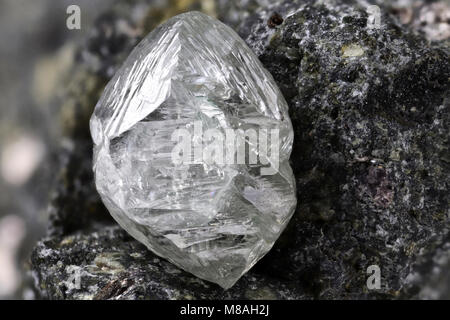 natural diamond nestled in kimberlite Stock Photo