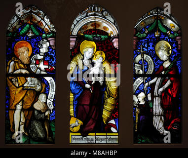 Virgin in an Aureola with St. John the Baptist and St. Margarete from the Charterhouse in Freiburg, Germany. Workshop of Hans Gitschmann, called von Ropstein, 1528. Stained glass. Schnütgen Museum. Cologne, Germany. Stock Photo