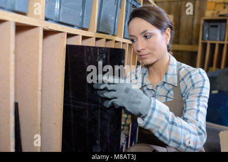 carpenter testing wood plank evenness Stock Photo