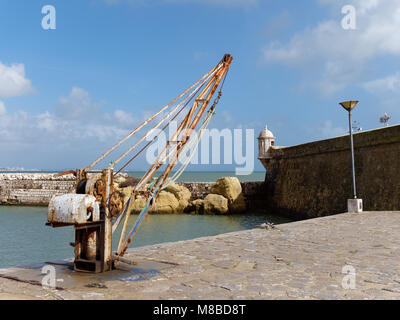 LAGOS, ALGARVE/PORTUGAL - MARCH 5 : Old Crane outside Fort Ponta da Bandeira in Lagos, Algarve Portugal on March 5, 2018 Stock Photo