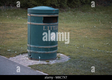 The litter bin in public park and litter around . Stock Photo