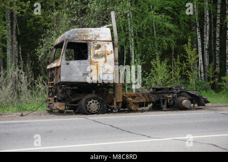 the truck after a fire on the road Stock Photo