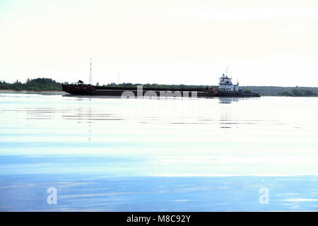 the Tug boat floats on the river Stock Photo