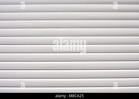 Windows with closed blinds on old building Stock Photo