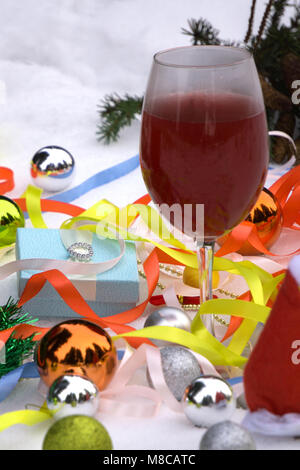 Christmas tree made from paper, candle light and glass of hot red wine Stock Photo