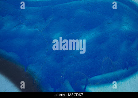 Abstract paint in hues of blue on concrete wall Stock Photo