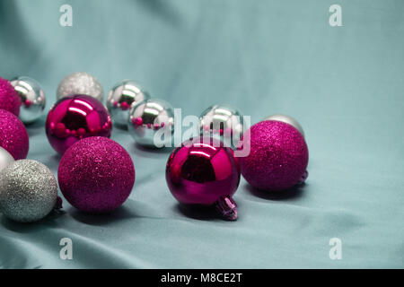 Red and silver Christmas decorations on crimson background Stock Photo