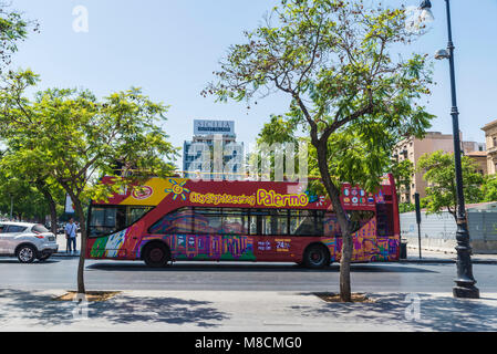 Palermo, Italy - August 10, 2017: Tour bus with tourists circulating on a street  in Palermo in Sicily, Italy Stock Photo
