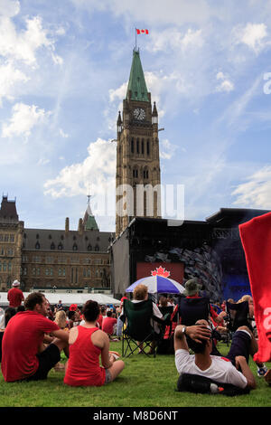 Ottawa, ON, Canada - July 1st 2014: People Gather for Canada Day on Parliament Hill Stock Photo