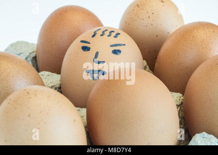 eggs smiling in the paper panel isolated on white background Stock Photo