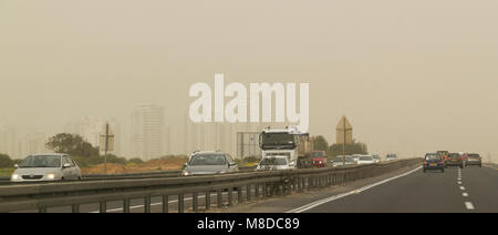 Netanya, Israel - March 08, 2018: Traffic in Highway num.2 in Center of Israel during Massive Spring sandstorm and low visibility.